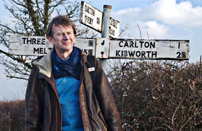 Michael Wood's Story of England (presenter Michael Wood by the road sign close to Kibworth, Leicestershire  Maya Vision)
