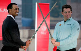 Tiger Woods and Lee Westwood pose with swords during a promotional event for the upcoming WGC-HSBC Champions tournament in Shanghai. Westwood took the world number one spot from Woods this week (Photograph: Carlos Barria/Reuters)
