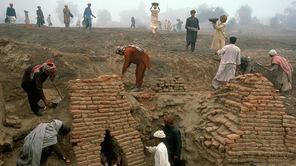 Workers excavate a brick culvert in Harappa, Pakistan.