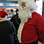 Steven Turgeon, dressed as Santa Clause waits his turn as a crowd filled the Country Style Donuts shop in Richmond, Va., on Christmas Eve, Friday, Dec. 24, 2010. Turgeon, from the area, said he just enjoys dressing up and getting out on Christmas Eve.