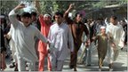 Afghans chant slogans as they protest the killing of four people overnight after a raid by NATO and Afghan forces, in Taloqan May 18, 2011.