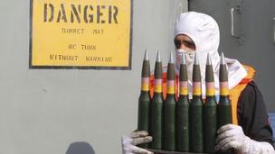 Iranian sailor with ammunition during military exercises in Sea of Oman - 31 December 2011