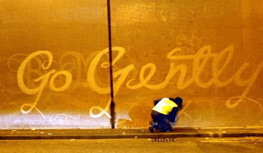 REVERSE GRAFFITI: Street Artists Tag Walls by Scrubbing Them Clean
