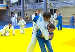 Putin shows young judo student some moves