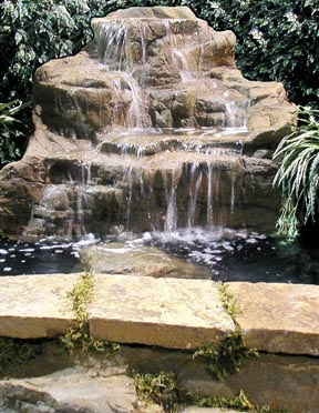 Rock Waterfall In Pond