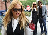 Rachel Zoe is smart and sophisticated in waistcoat-style dress as she takes a city stroll with husband Rodger 