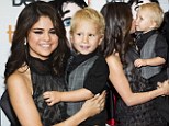 Selena Gomez kisses Jaxon Bieber, Canadian singer Justin Bieber's little brother, as she arrives on the red carpet for the gala presentation of the film Hotel Transylvania at the 37th Toronto International Film Festival