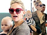He's a Mummy's boy! Baby Bingham is the spitting image of his famous mother Kate Hudson as they jet out of Toronto
