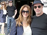 Biker John! Travolta unveils a new youthful look as he enjoys a romantic meal in Paris with wife Kelly Preston