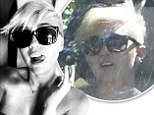 They came in handy! Miley Cyrus licks her lips as she shows off her new sunnies from her fianc in Twitter snap before she wears them the next day to hide a hangover