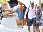 Daddy's boy! Doting father Liev Schreiber dangles little Sasha upside down during a fun family day out with wife Naomi Watts