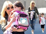 Hands on: Heavily pregnant Sarah Michelle Gellar carried her daughter on the school run on Tuesday 