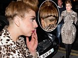 Lady Gaga flaunts head tattoo...and hides fuller frame under a leopard-print dress in Paris