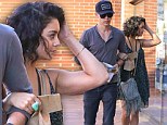 Mirror, mirror on the wall ... Vanessa Hudgens checks her look in a shop window as she strolls with beau Austin Butler 