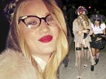 What does a Victoria's Secret model wear for Halloween? Rosie Huntington-Whiteley shows off legs in stockings and suspenders