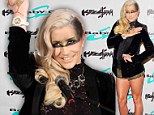 Ke$ha has no time for trousers as she slips into black and gold pants at watch unveiling