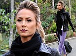 Not a diva just yet! Rock chick Stacy Keibler happily wheels her own suitcase as she jets off to Las Vegas