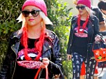 That is a scary outfit! Christina Aguilera wears tight skull-and-crossbone leggings to son Max's school parade