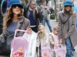 Sarah Jessica Parker's twin girls are quite the little mothers as they push their dolls along in matching strollers