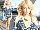 Blue overkill! Glum Paris Hilton goes overboard with coordinated colours as she jets out of LA