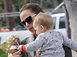 Supermum: Jennifer Garner takes son Samuel and a toy doll on a stroll through Brentwood, California