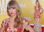 Lady in red: Taylor Swift wowed photographers at the CMA Awards