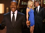 No wonder he's smiling! Eddie Murphy shows off latest squeeze Paige Butcher at TV tribute evening
