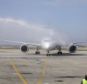 Touchdown: A United Airlines 787 Dreamliner receives a ceremonial wash as it arrives at O'Hare international Airport in Chicago on Sunday
