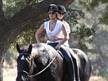 Heading for the sunset: Jillian Michaels and her partner Heidi Rhoades go on a romantic date horseback riding