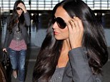 Low key glamour: Relaxed Demi Moore works the casual style in simple jeans and blazer as she jets out of LAX 