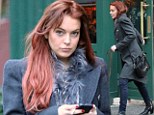 What storm? Life goes on as normal for Lindsay Lohan as she enjoys posh New York lunch