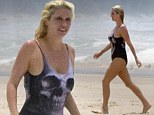 By the power of grayskull... Ke$ha's beach look is saved by quirky one-piece 