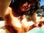 Risqu Rihanna posts yet another sultry picture of herself in a tiny two-piece