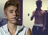 Bieber's trying to bulk up! Justin flexes what muscles he has as he posts topless Twitter snap