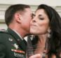 Close: General David Petraeus kisses Jill Kelley after accepting community service award presented at Kelley's Florida home during the summer of 2011