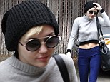 Miley Cyrus keeps it under her hat again in favourite beanie as she flashes toned tummy in crop top