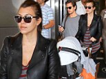 Back to reality: Kourtney Kardashian is low key in leather as she and Scott Disick jet into Miami after whistlestop trip to Europe