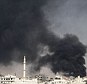 Smoke rises from an airstrike on the eastern Damascus suburbs. France and the UK want to try and speed up the exit of dictator Bashar al Assad from Syria