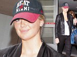 Make-up free Kate Upton is not ready for the runway as she hides under hat on trip through airport 