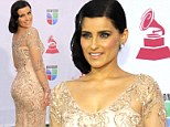 Cream of the crop! Nelly Furtado steals the arrivals show at the Latin Grammy awards in a stunning embroidered gown