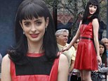 Scarlet woman! The B---- in Apart 23 Krysten Ritter plays up to her devilish reputation in sinful red leather dress