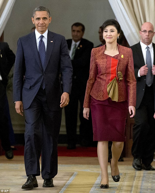 Quick trip: Obama and Thai Prime Minister Yingluck Shinawatra arrive for a joint news conference during his three-day trip to Asia