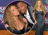 Busting out! Mariah Carey showed off daring cleavage while cheering on husband Nick Cannon at the HALO Awards in L.A.