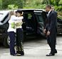 Hillary Clinton gives Aung San Suu Kai a big hug after arriving with President Obama at her residence in Yangon, Myanmar on Monday