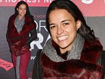 That's a fiery look! Michelle Rodriguez teams fur and leather jacket with burgundy jeans to attend Forever Crazy burlesque show