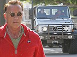 I'll be back... don't give me a ticket! Arnold Schwarzenegger lands his 14 tonne monster truck on the curb in parking fail 