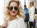 Rita Ora swapped her usually colourful clothes for a monochrome outfit in Germany on Thursday