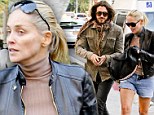 Stone cold fox! Sharon Stone braces against the cold but still manages to flash some serious leg while out with toy boy lover