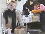 It's turkey time! Marcia Cross and Milla Jovovich load up their trolleys in preparation for the holiday feast