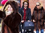 Taxi! Sienna Miller hails down a cab as she enjoys a Sunday stroll with baby Marlowe and fianc Tom Sturridge